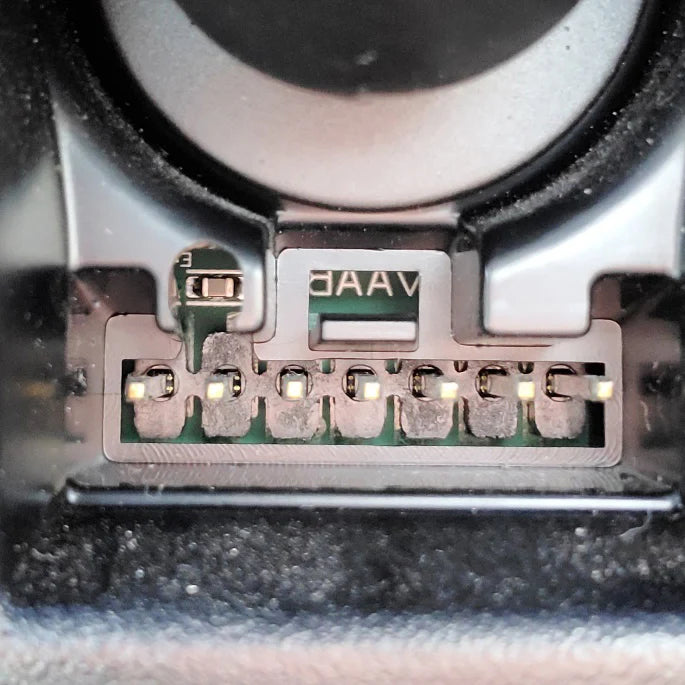 Close-up of a mechanical component with 'DAAV' branding on a blurred background