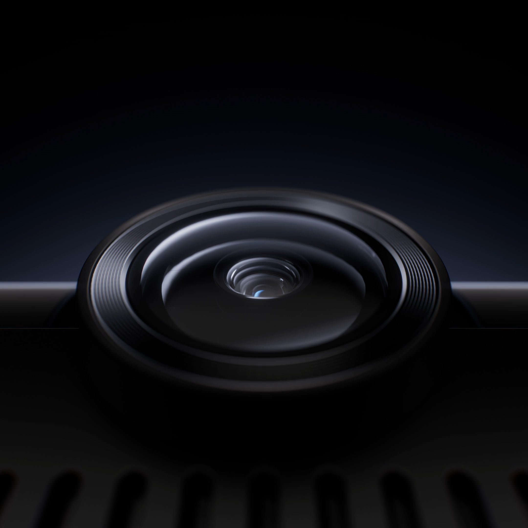 Close-up of a camera lens on a dark background