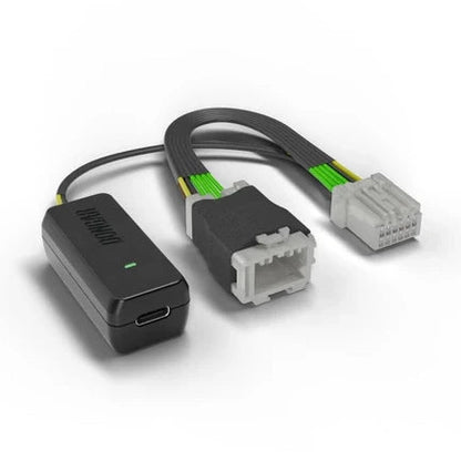 Dongar dash cam adapter with USB-C port, lit green LED, and gray white multi-pin connectors