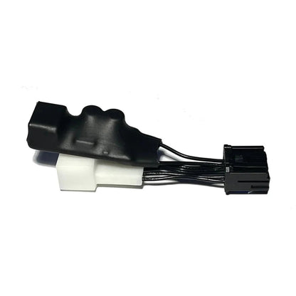 Black auto-dimming mirror power adapter with molded cover and integrated wiring, attached to white base and black multi-pin connector for tidy cabin look