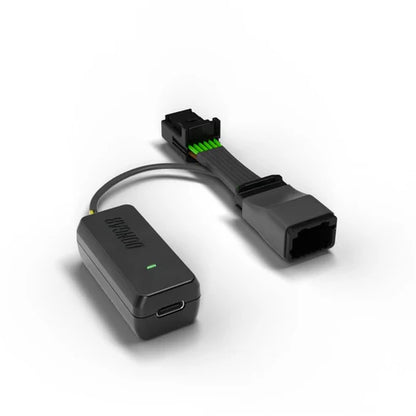 Dongar hardwire adapter with USB-C port and black multi-pin connector showing green wires