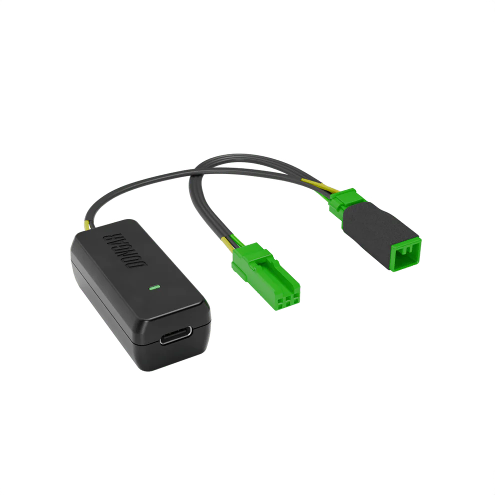 Black Dongar adapter with bright green plastic connectors and yellow-green internal wires, emphasizing plug-and-play interface for factory-look dash cam setup