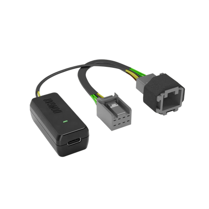 Matte black Dongar Classic adapter with USB-C port and textured rubberized male connector, showing multi-strand yellow and brown wires for robust mirror power