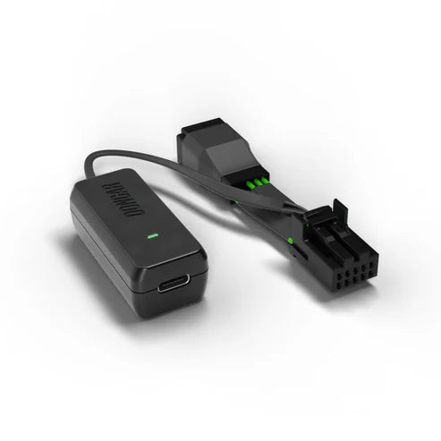 Black Dongar dash cam adapter with USB-C port and green LED on white background