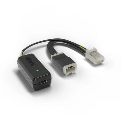 Dongar Classic adapter with USB-C port, lit green LED, and yellow green internal wires