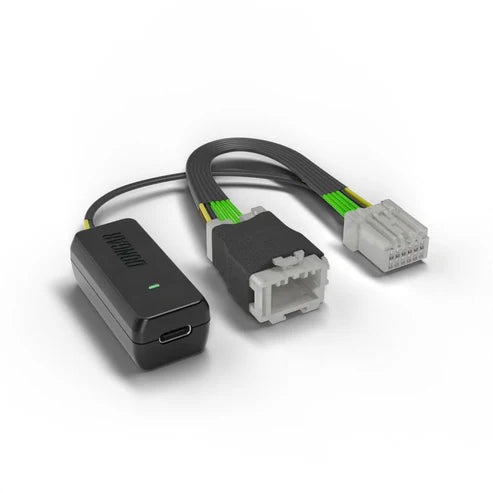 Dongar dash cam adapter with USB-C port, lit green LED, and gray white multi-pin connectors