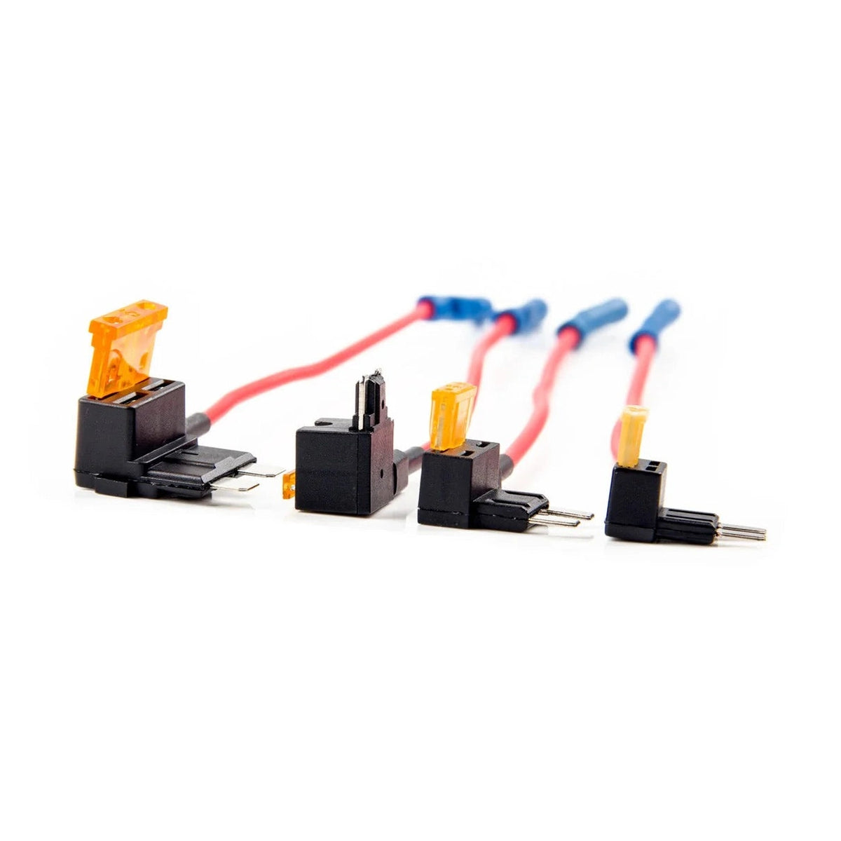Black fuse tap connectors holding orange blade fuses showing two and four prong designs