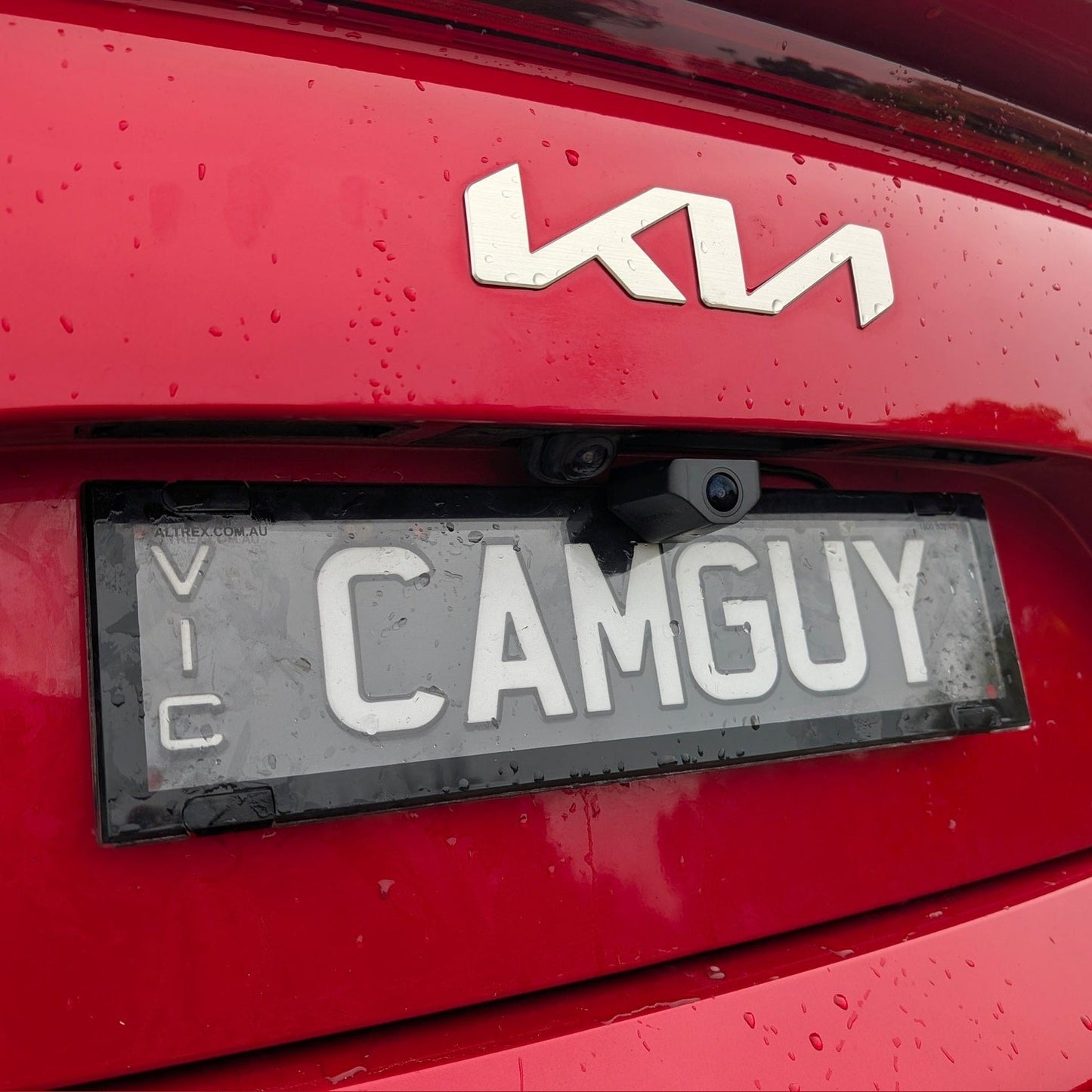 Rear view of Wolfbox camera bracket holding Aussie number plate