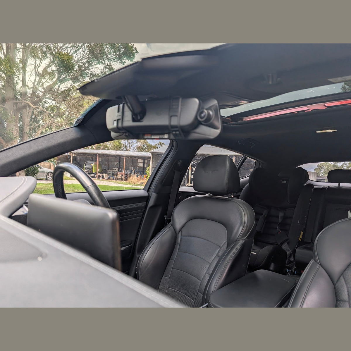 WOLFBOX G900 Pro front dash cam mounted on car windshield