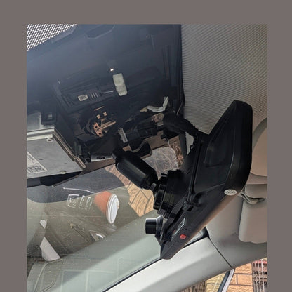 WOLFBOX mirror mount installation showing wiring and adjustable arm inside vehicle