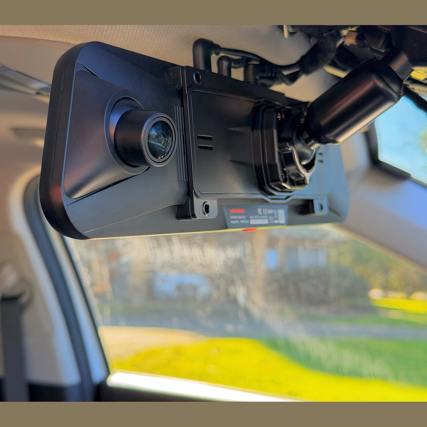 WOLFBOX G900 Pro dash cam mounted on car rearview mirror with bracket