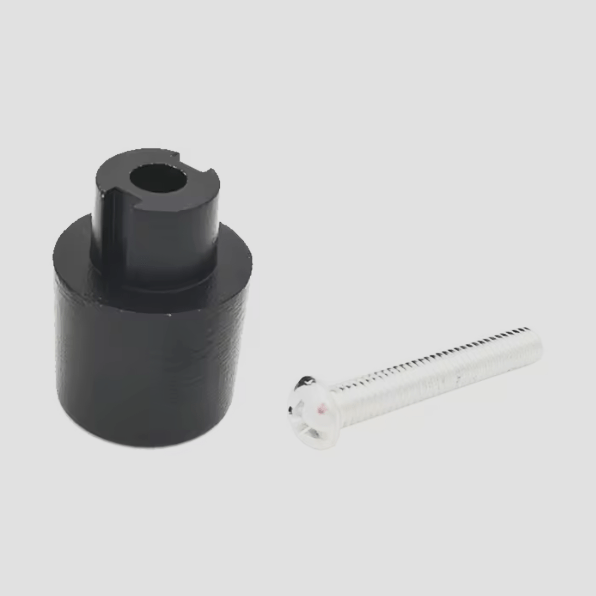 Black cylindrical adapter piece and silver metal screw for mirror mount installation