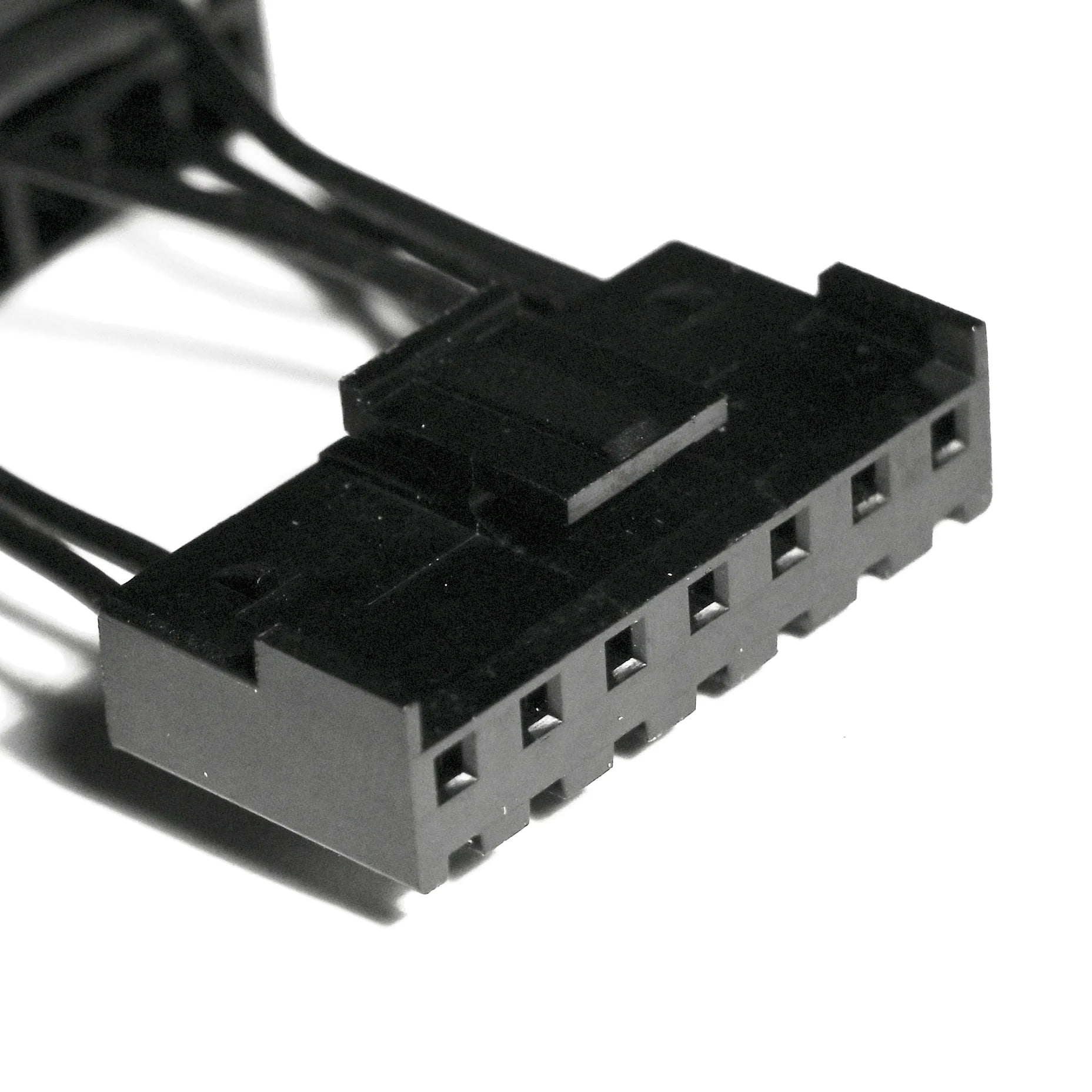 Close-up of a black electrical connector on a white background