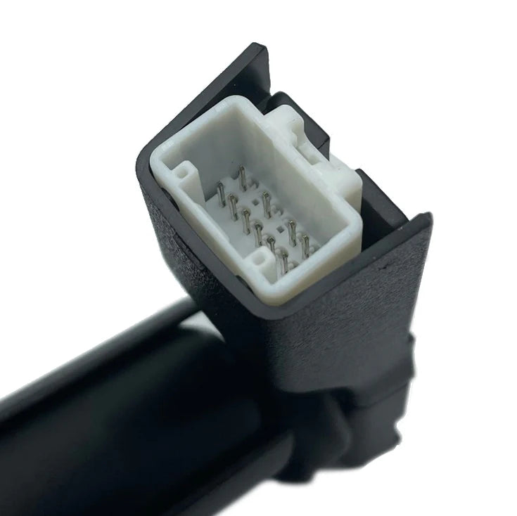 Close-up of a black and white automotive connector on a white background